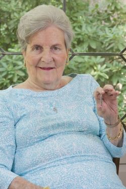 Ruth Deaton holds a miniaturized insertable cardiac monitor like the one she received in July to  help determine if irregularities in her heart are responsible for a stroke she had in May